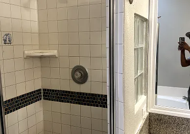 Kitchen backsplash tiles before reglazing with worn-out finish