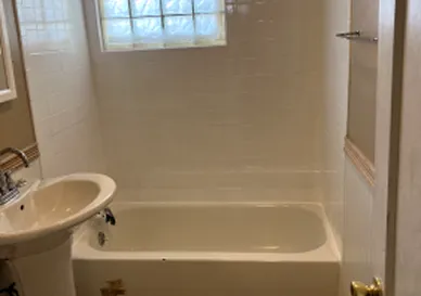 Bathroom tiles after reglazing with bright glossy finish