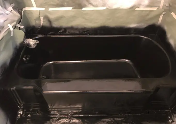 After shower reglazing showing restored shine and smooth surface