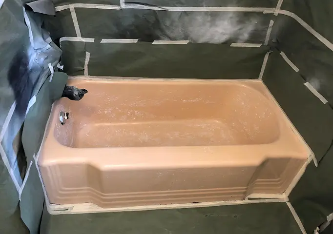 Before shower reglazing showing restored shine and smooth surface