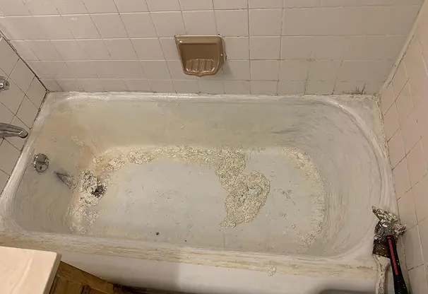 Before comparison of sink reglazing showing flawless transformation