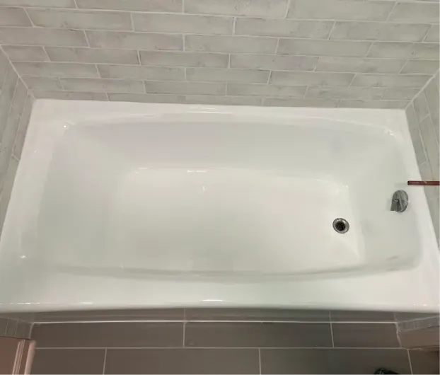 Freshly refinished white bathtub with a durable glossy coating