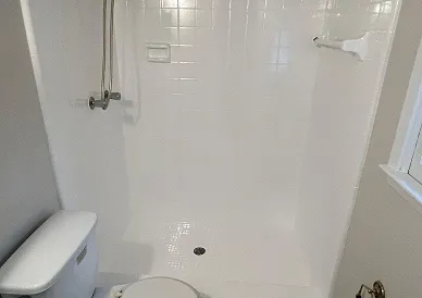 Bathroom tiles after reglazing with bright glossy finish