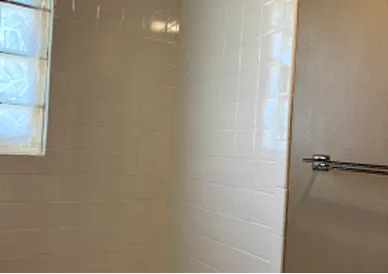 Refinished bathtub with bright white finish and restored shine